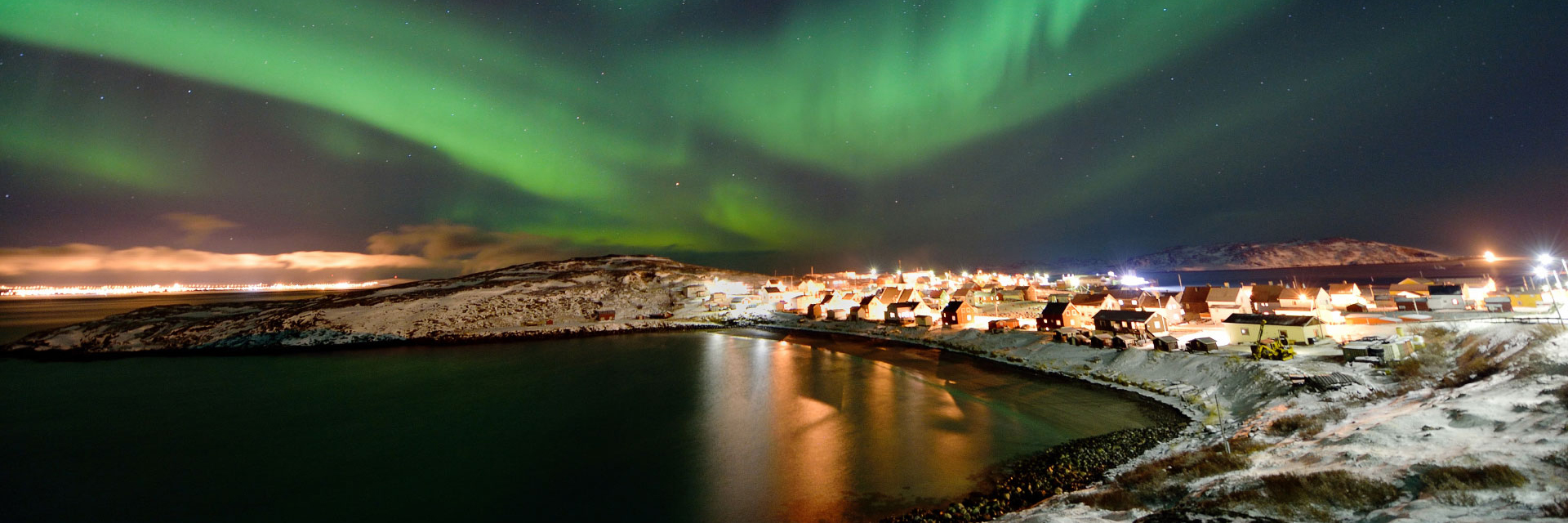 View of the Bugoynes Fishing Village in Winter under the Northern Lights