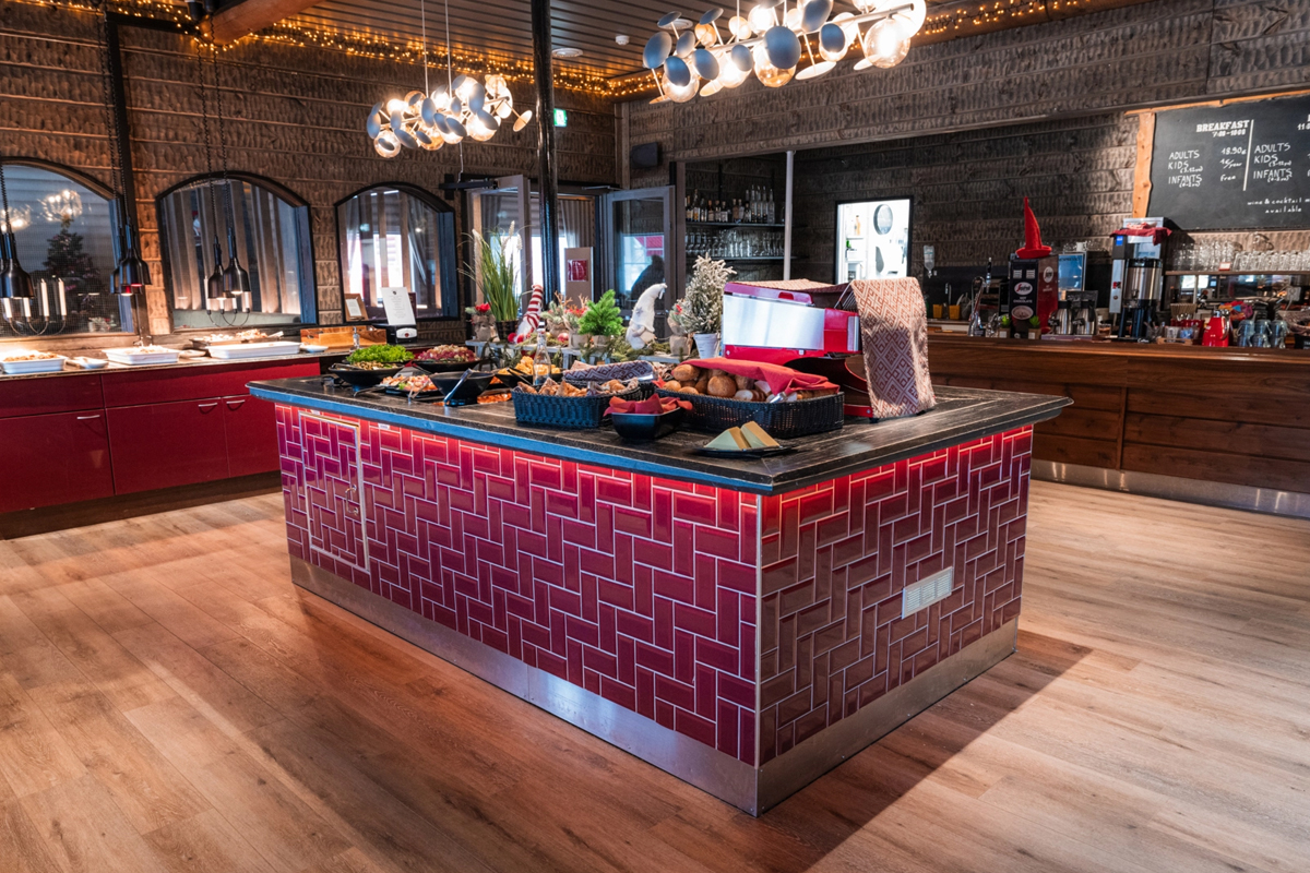 Buffet counter at Christmas House breakfast café with pastries, fresh produce and a coffee station, Santa Claus Holiday Village, Rovaniemi