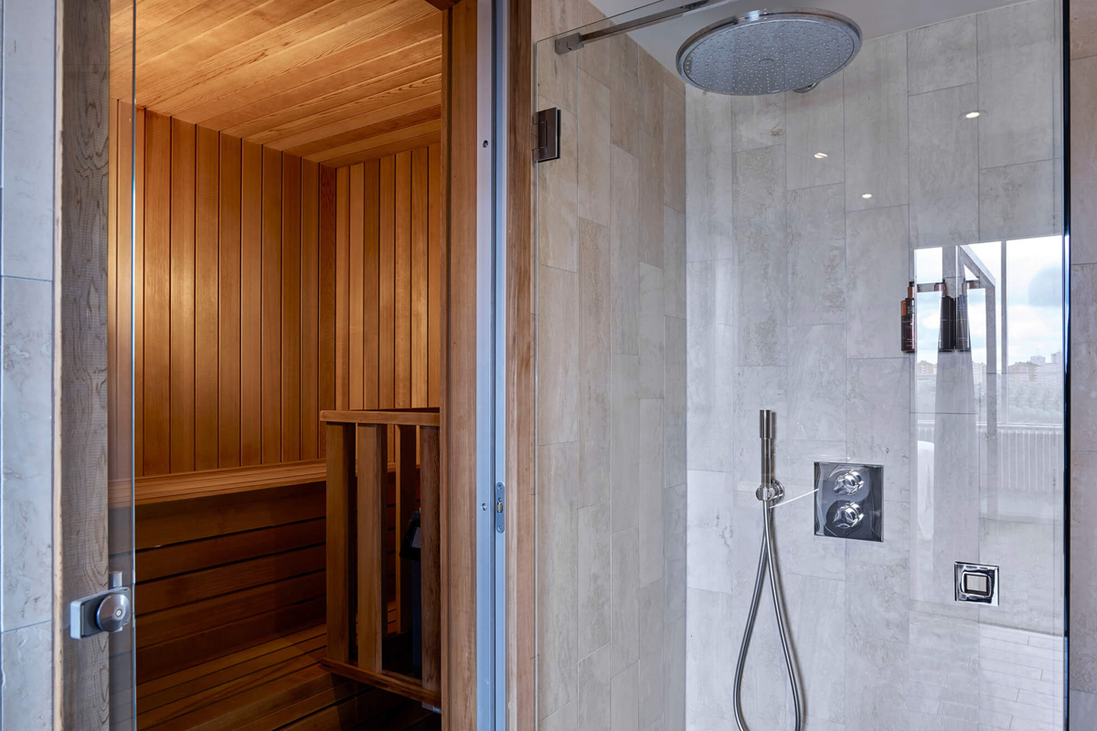 Private sauna and rain shower in a suite bathroom at Clarion Hotel Stockholm in Södermalm.
