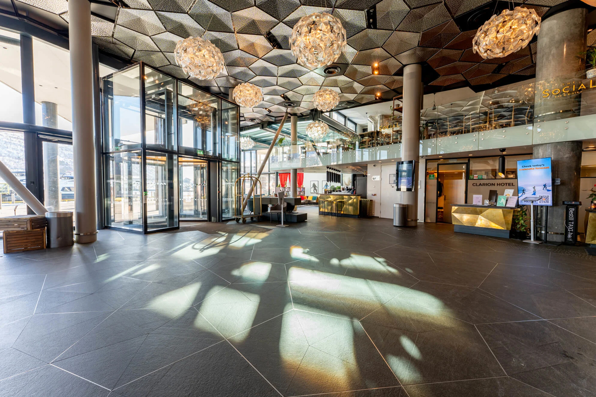 The spacious lobby entrance with sculptural ceiling lights at Clarion Hotel The Edge, Tromso.