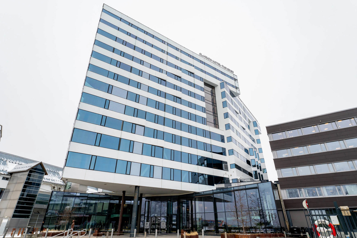 The angular glass facade of Clarion Hotel The Edge rises above the Tromso waterfront.