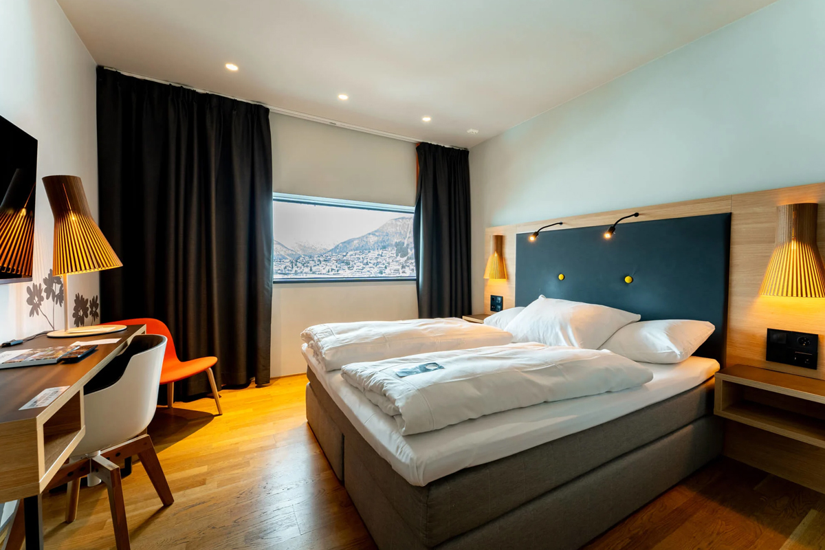 A modern double room with city and mountain views at Clarion Hotel The Edge, Tromso.