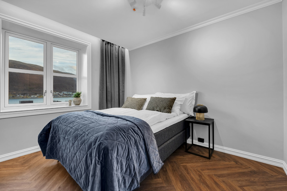 Bedroom at St. Elisabeth Hotel & Spa in Tromso, with a view over the water.