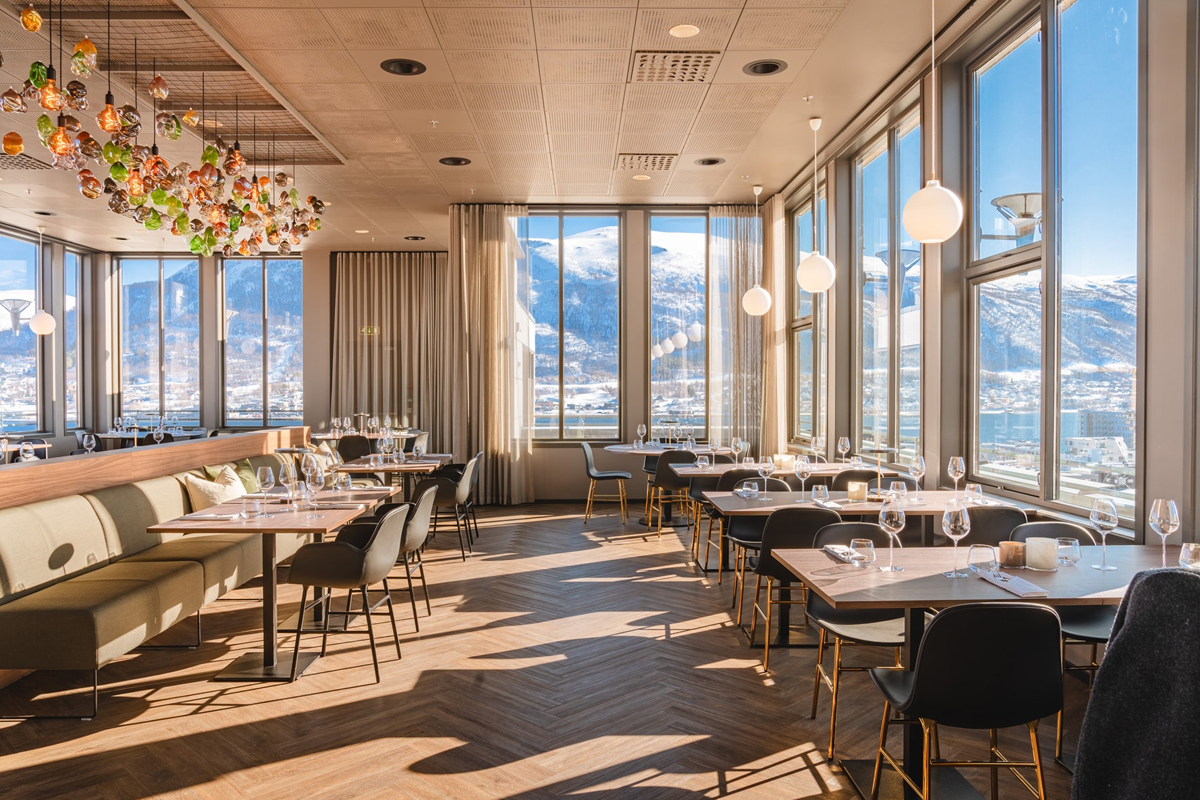 Restaurant at St. Elisabeth Hotel & Spa in Tromso, with panoramic mountain views.