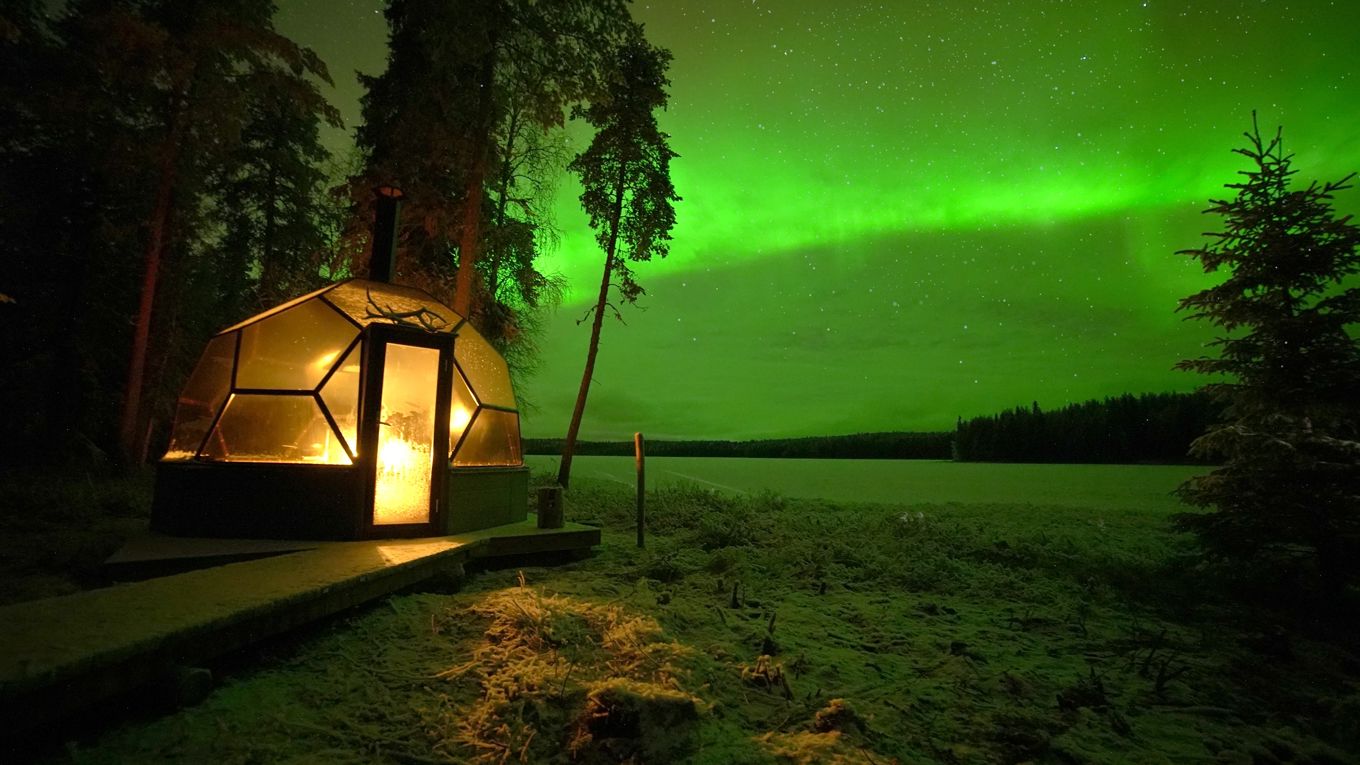 Dinner in a glass igloo under the Northern Lights