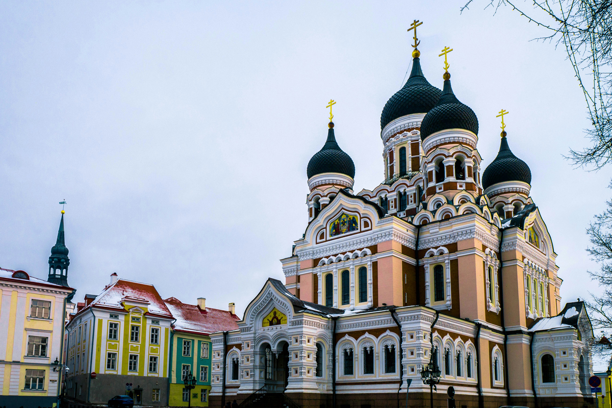 Alexander Nevsky Cathedral on Toompea Hill in Tallinn, with its ornate facade and onion domes against a winter sky.