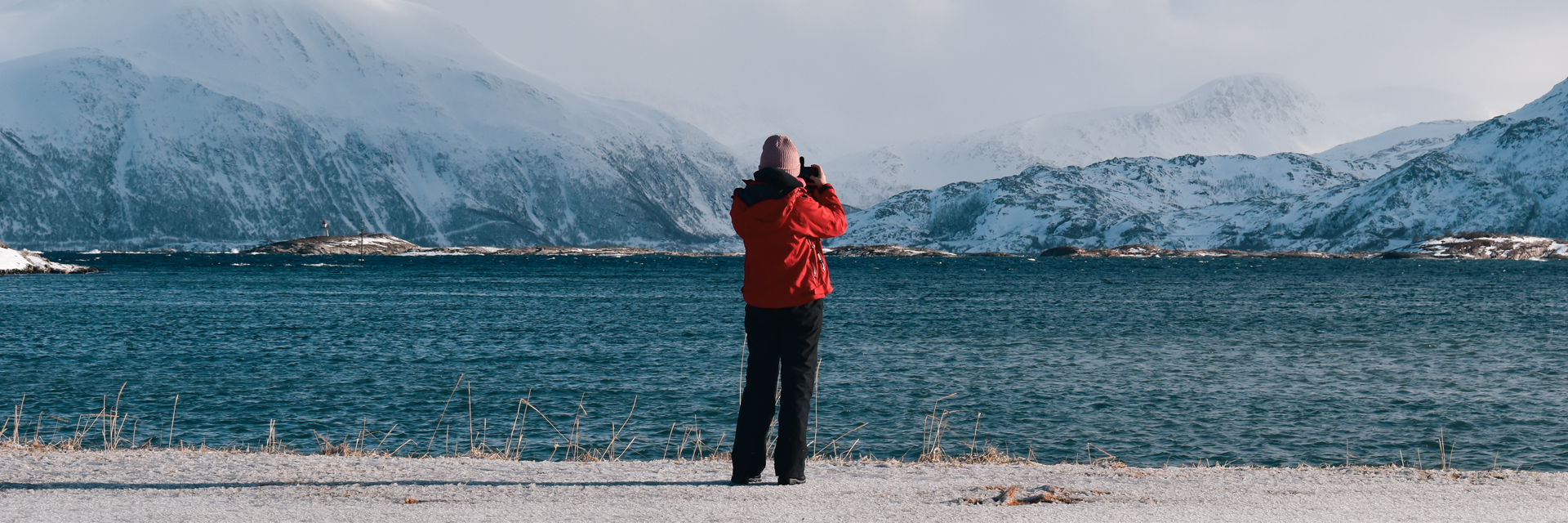Traveler photographing the fjord landscape between Kilpisjarvi and Tromso. Photo: Joona.