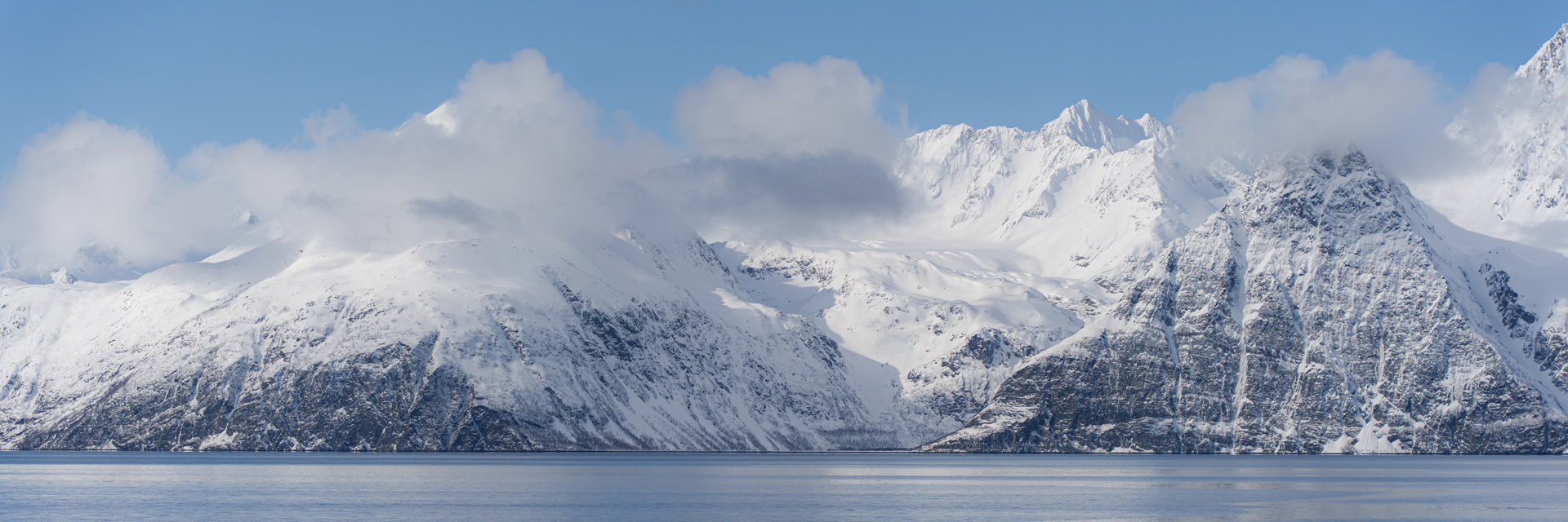 Fjord and snow-capped mountains in Norwegian Lapland, Lapland Private